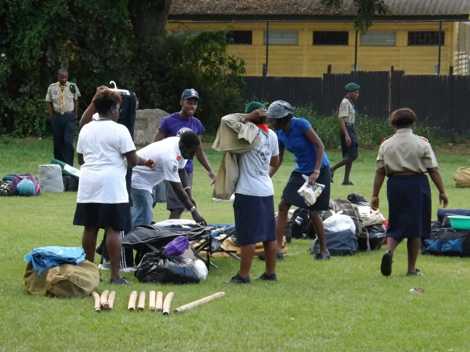 Uniformed adults taking part in practical outdoor training.