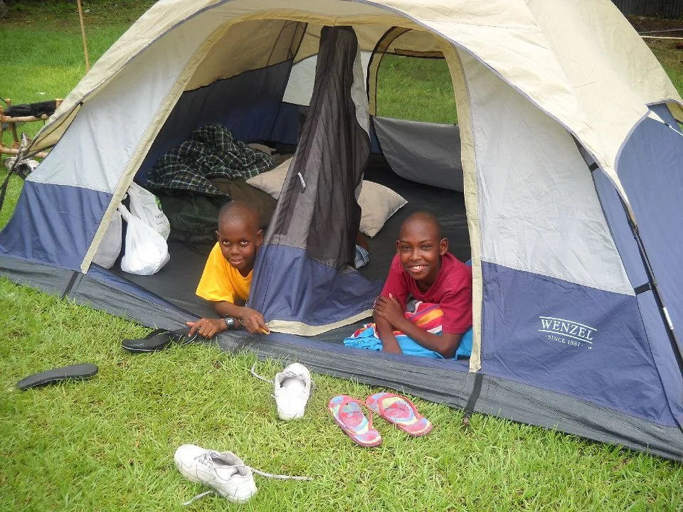Young people together at a campsite.